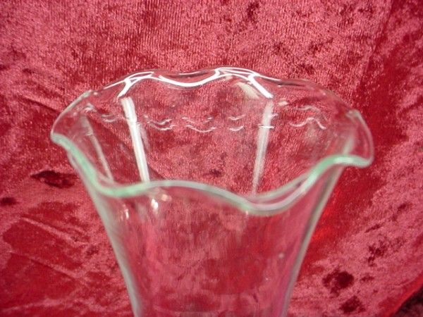 Up forone low price is a lovely glass trumpet vase created in the WWII 