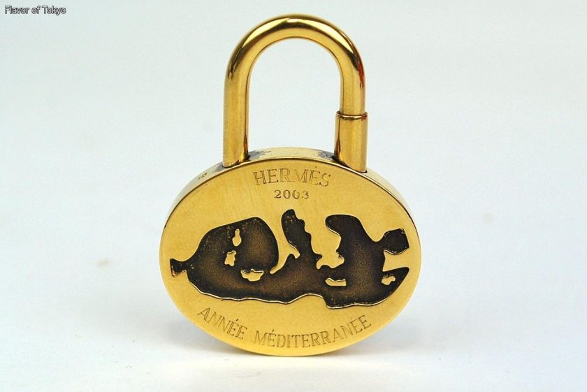 HERMES Goldtone Annee Mediterranee Cadena Lock Charm  