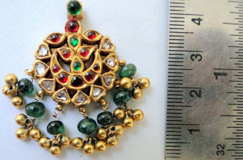 Antique gold kundan pendant with diamond rubies emerald  