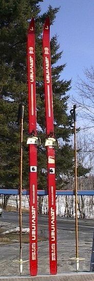 lot of snowshoes skis toboggans paddles and oars listed with a wide 